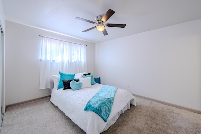 carpeted bedroom with ceiling fan