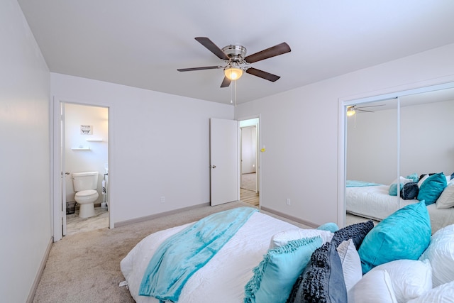 bedroom featuring ceiling fan, light colored carpet, connected bathroom, and a closet