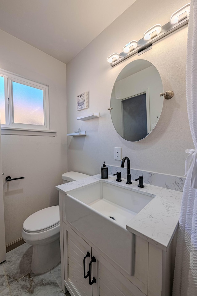 bathroom with vanity and toilet