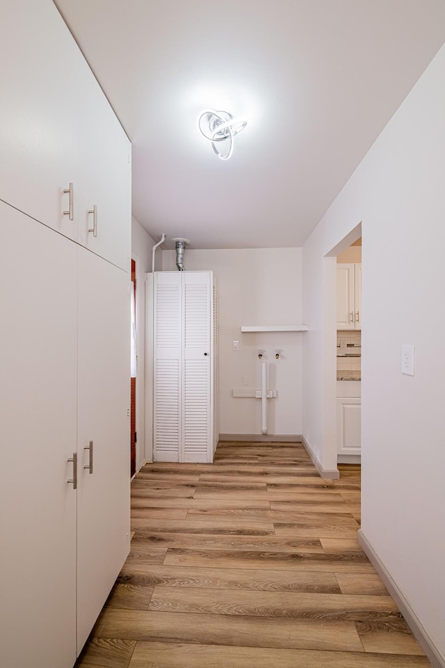 hallway featuring light hardwood / wood-style flooring