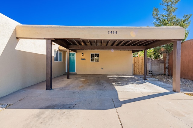 exterior space featuring a carport