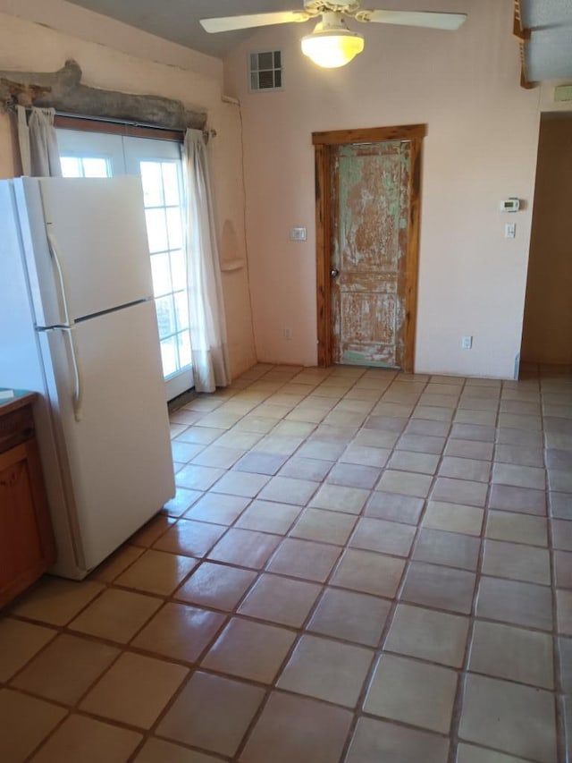 interior space featuring ceiling fan and light tile floors