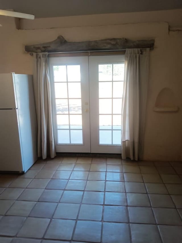 interior space with french doors and tile floors