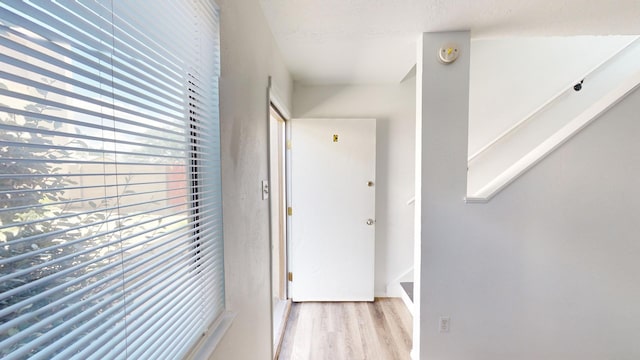 corridor featuring light hardwood / wood-style floors