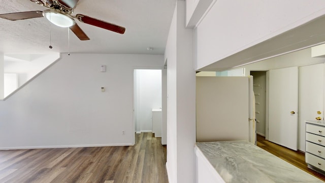 interior space with ceiling fan and hardwood / wood-style floors