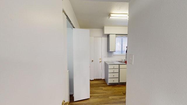 corridor featuring hardwood / wood-style floors