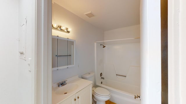 full bathroom featuring bathing tub / shower combination, toilet, and vanity