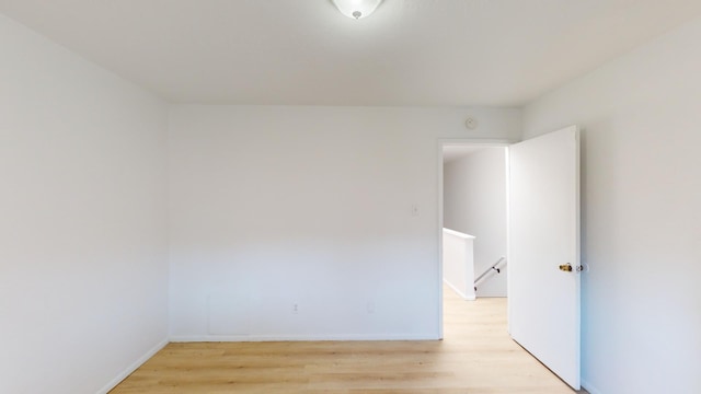 empty room with light wood-type flooring