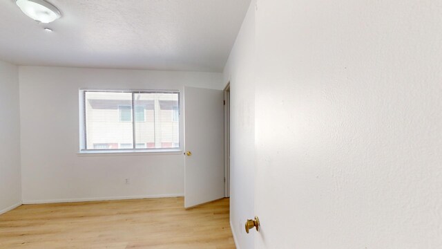 spare room featuring light hardwood / wood-style floors