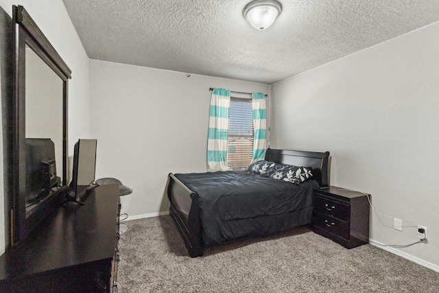 carpeted bedroom with a textured ceiling