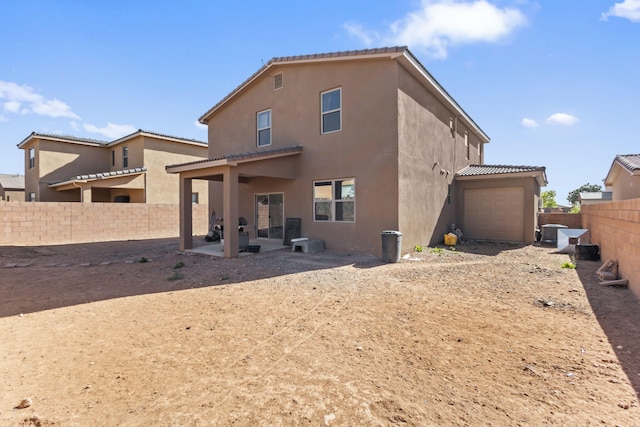 back of house featuring a patio area