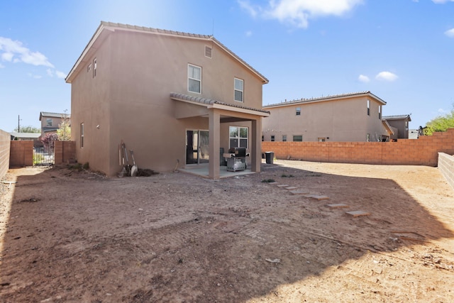 rear view of house with a patio area