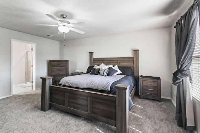 bedroom with ceiling fan, carpet, ensuite bathroom, and a textured ceiling