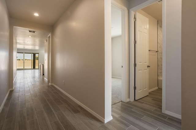 hallway featuring dark hardwood / wood-style floors