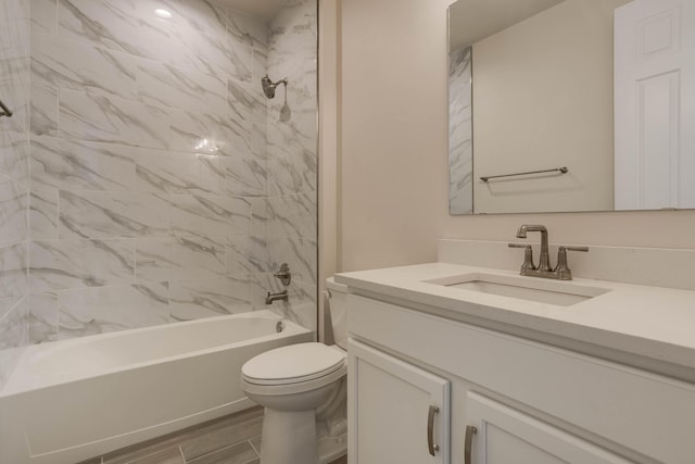 bathroom with shower / bath combination, wood tiled floor, toilet, and vanity