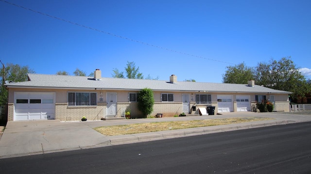 ranch-style home featuring a garage