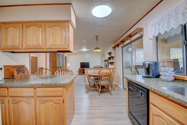 kitchen featuring light brown cabinetry, light hardwood / wood-style flooring, a textured ceiling, black dishwasher, and pendant lighting