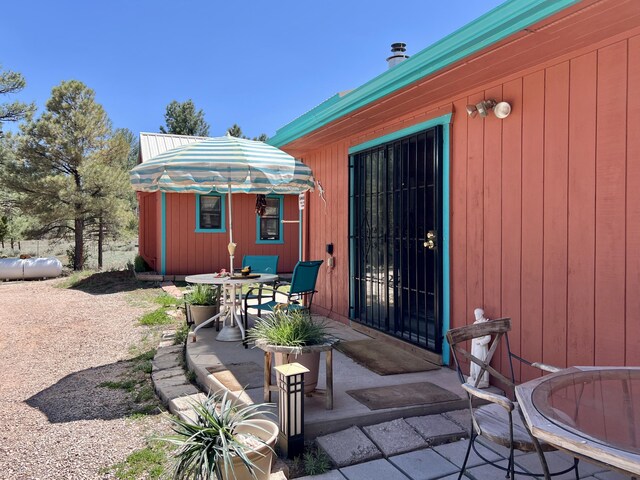 787 Timberlake Rd, Ramah, NM 87321 - sunroom / solarium with wooden walls, vaulted ceiling, and a ceiling fan
