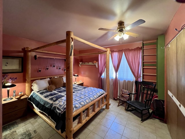 bedroom with ceiling fan and light tile patterned flooring