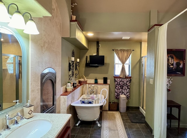 bathroom with separate shower and tub, tile patterned floors, and vanity