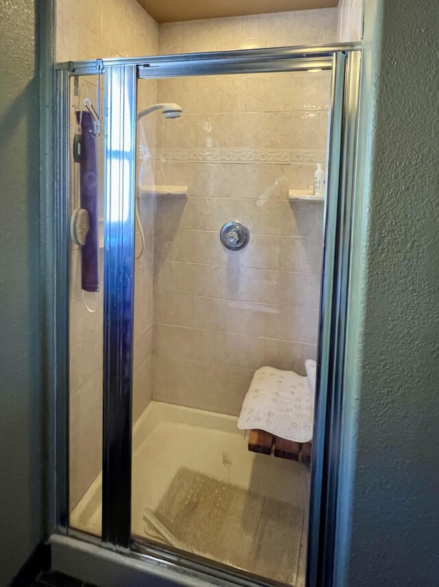 787 Timberlake Rd, Ramah, NM 87321 - full bathroom with a shower stall, vanity, a freestanding tub, and tile patterned floors