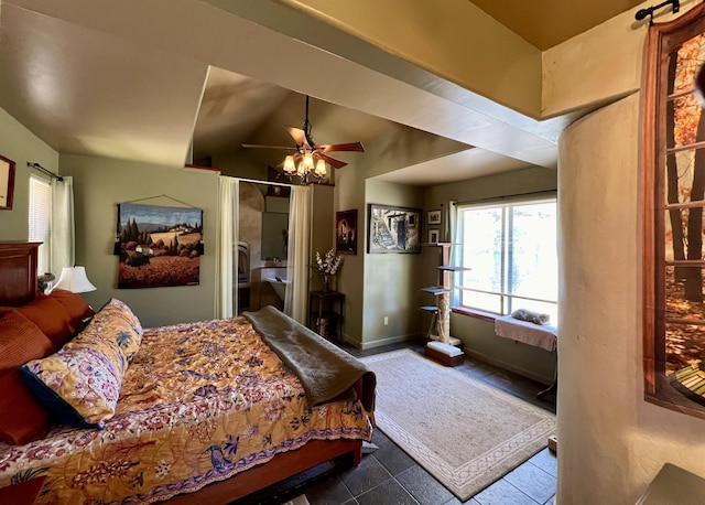 tiled bedroom with ceiling fan and lofted ceiling