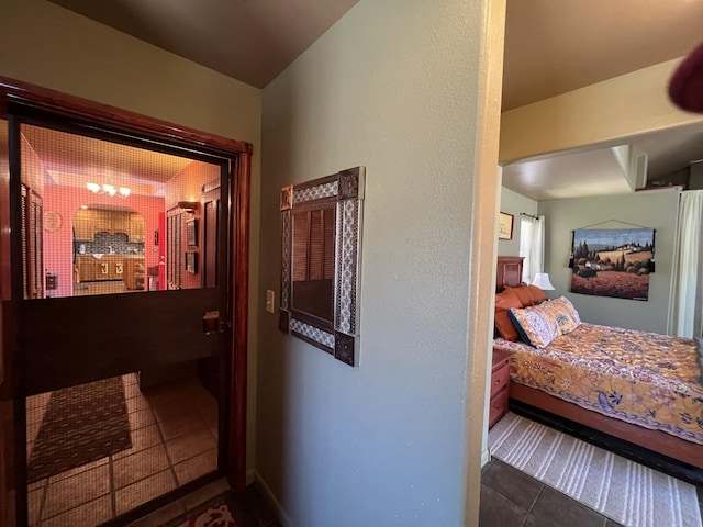 hallway with dark tile patterned flooring