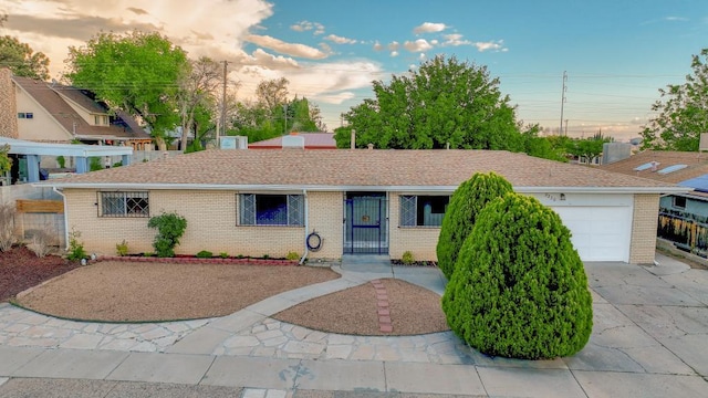 single story home featuring a garage