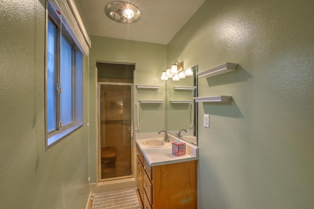 bathroom featuring vanity and walk in shower