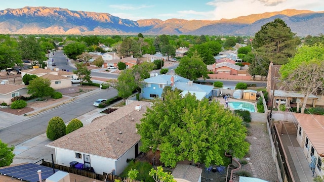 birds eye view of property with a mountain view