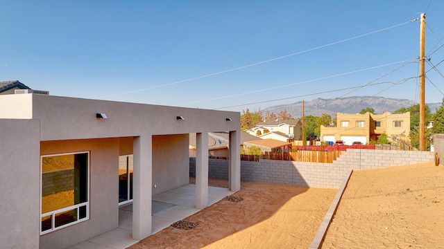 view of yard with a patio area and a mountain view