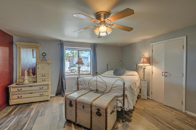 bedroom featuring ceiling fan and hardwood / wood-style floors