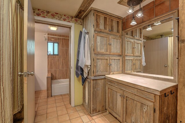 bathroom with vanity, shower / bath combination with curtain, and tile patterned floors