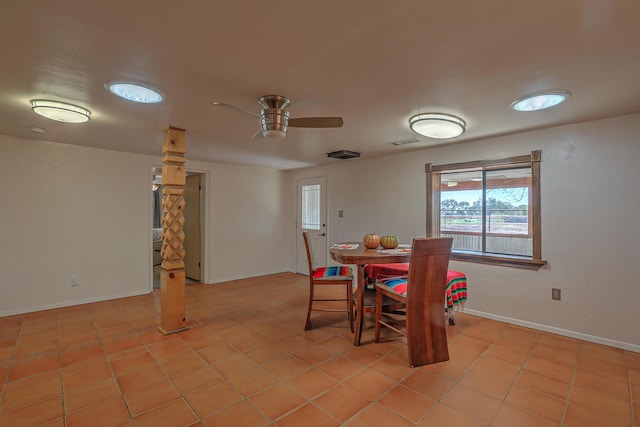 tiled dining area featuring ceiling fan