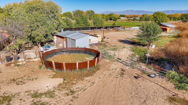 birds eye view of property featuring a mountain view