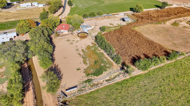 birds eye view of property featuring a rural view