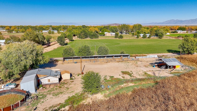 birds eye view of property with a mountain view and a rural view