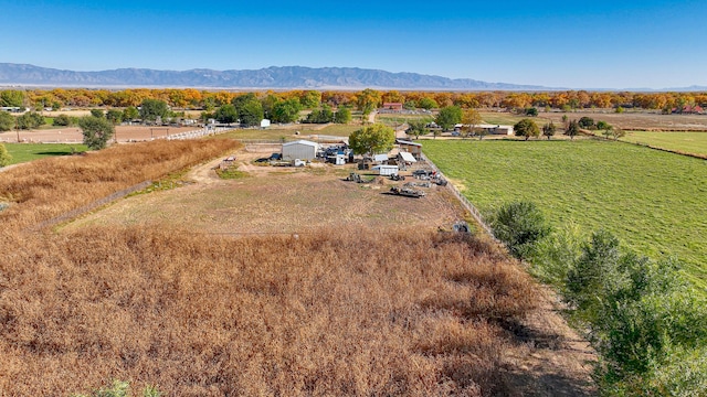 birds eye view of property with a mountain view and a rural view