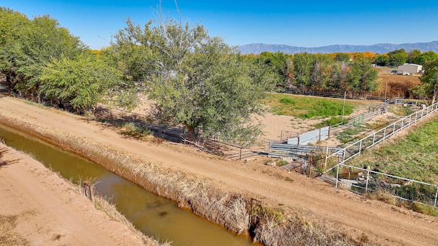 bird's eye view with a water and mountain view and a rural view