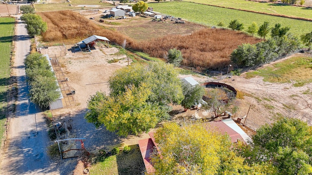 birds eye view of property with a rural view