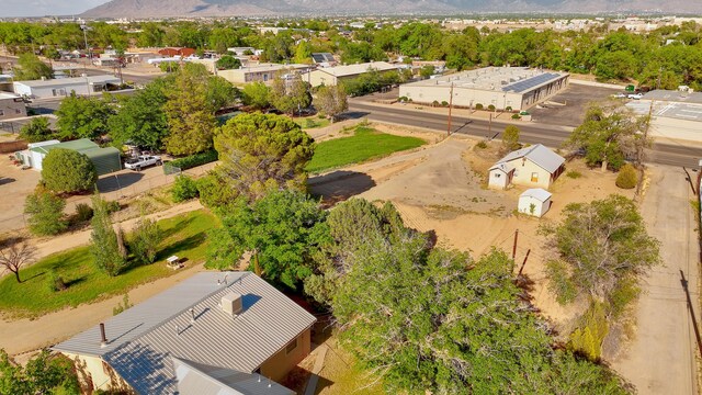 birds eye view of property with a mountain view