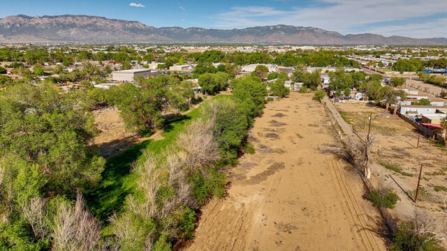 birds eye view of property with a mountain view