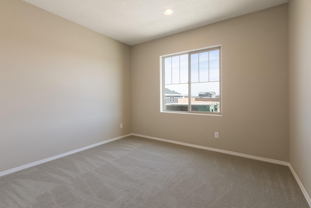 unfurnished room featuring carpet flooring