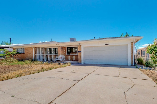 single story home featuring a garage