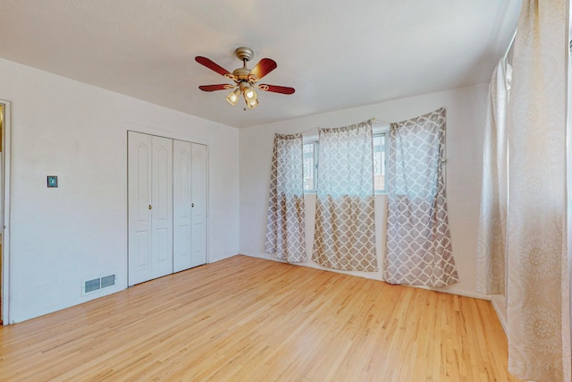 unfurnished room featuring ceiling fan and light hardwood / wood-style flooring