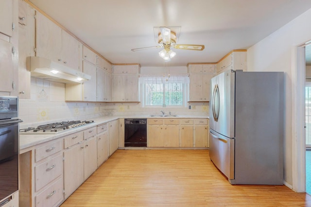 kitchen with ceiling fan, light hardwood / wood-style floors, tasteful backsplash, black appliances, and sink