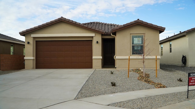 view of front of home with a garage