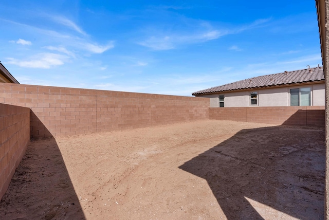 view of yard with a fenced backyard