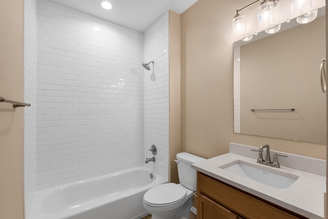 bathroom featuring recessed lighting, shower / bathing tub combination, toilet, and vanity