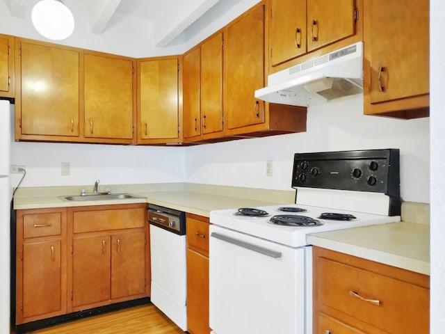 kitchen featuring sink, white appliances, and light hardwood / wood-style floors